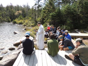 Seniors take in Holy Mass overlooking Lonesome Lake in Franconia Notch